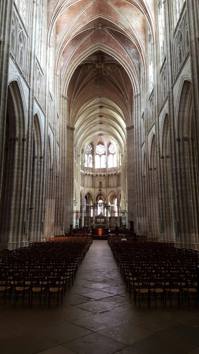 A large cathedral filled with lots of pews